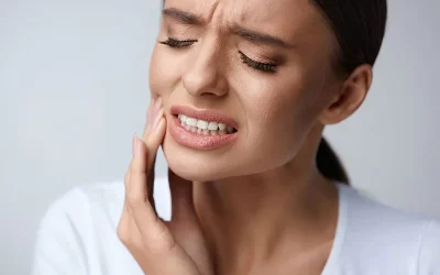 What should I do in case of a dental emergency, like a knocked-out tooth or severe toothache?